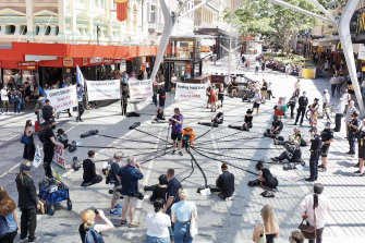Four Extinction Rebellion protesters were arrested on Tuesday in Brisbane’s Queen St Mall. 