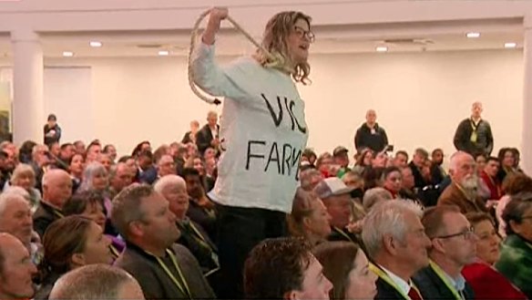 A protester with a noose at the Bush Summit.