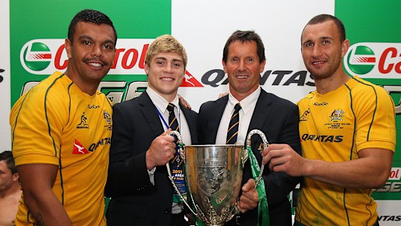 Kurtley Beale, James O’Connor and Quade Cooper with Wallabies coach Robbie Deans after winning the 2011 Tri Nations trophy. 