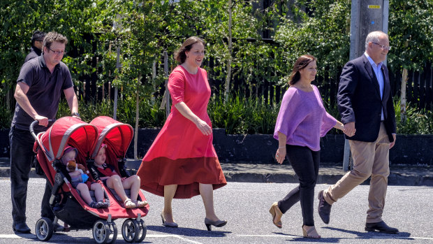Minister for Women, Kelly O'Dwyer, pictured with her family and the Prime Minister, Scott Morrison, on the day she announced her departure from Parliament at the next election.
