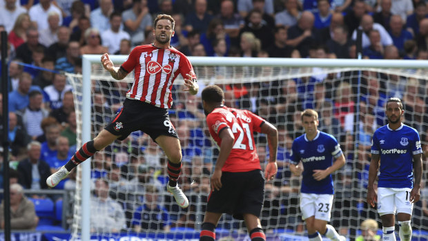 Giant leap: Southampton's Danny Ings (left) celebrates his side's first goal against Everton.