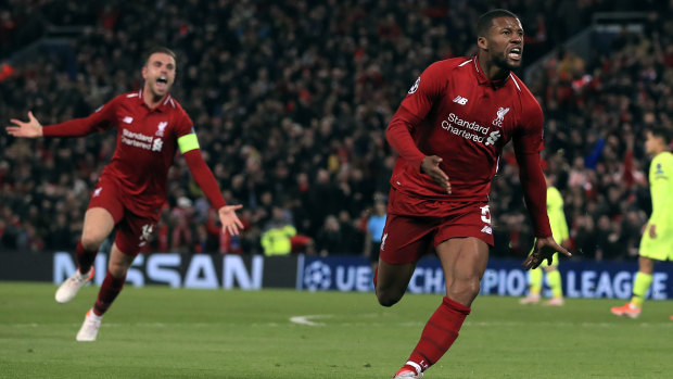Georginio Wijnaldum celebrates scoring Liverpool's third goal.