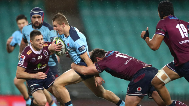 James O’Connor readies himself to make a tackle on Joey Walton in last year’s big Waratahs win over the Reds. 