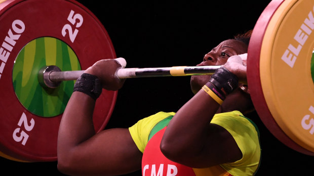 Arcangeline Fouodji Sonkbou, of Cameroon, during the women's 69kg weightlifting competition on day four of the Commonwealth Games on the Gold Coast. The Cameroon team has reported her missing.