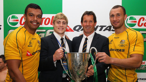 Kurtley Beale, James O’Connor and Quade Cooper with Wallabies coach Robbie Deans after winning the 2011 Tri Nations trophy. 