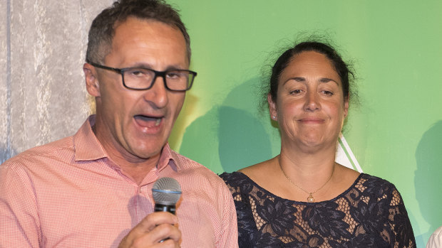 Standing with candidate Alex Bhathal, Greens leader Richard Di Natale concedes defeat in Batman last month.