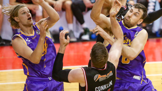 Key figure: Sydney Kings centre Andrew Bogut fights for the ball in a pre-season hit-out against the Hawks.