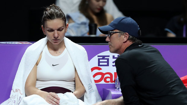 Darren Cahill advises Simona Halep during her eventual win at the WTA Finals.