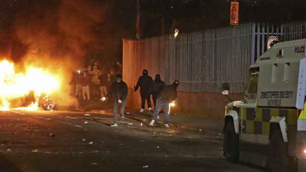Petrol bombs are thrown at police in Londonderry, Northern Ireland, on the night that Lyra McKee was killed.