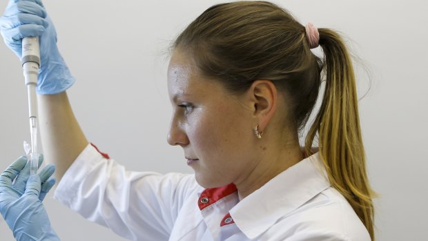 An employee works with a coronavirus vaccine at the Nikolai Gamaleya National Centre of Epidemiology and Microbiology in Moscow.