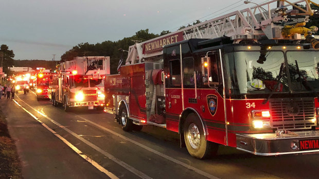 Multiple fire trucks from surrounding communities arrive in Lawrence, Massachusetts.