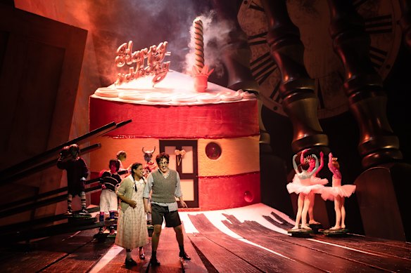 Stacey Alleaume as Gretel and Margaret Plummer as Hansel out front of the gingerbread house.