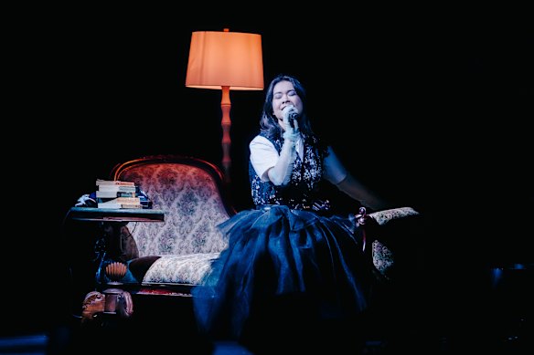 Indie-rock star Mitski donne a gothic eccentric look with red stockings and black tulle.