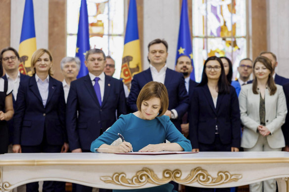 President Maia Sandu signs the decree initiating Moldova’s EU accession negotiations, in Chisinau in June.