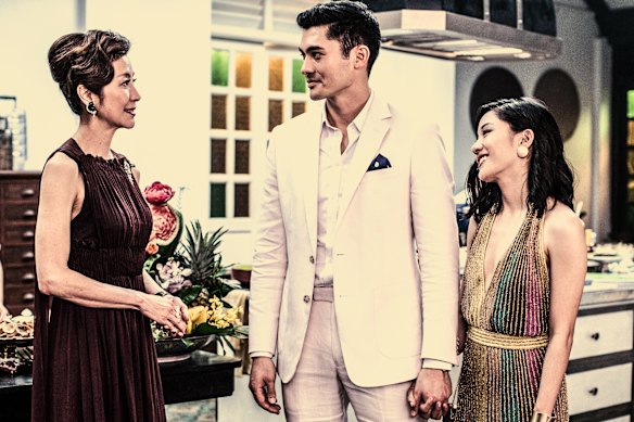 Henry Golding as Nick Young and Constance Wu as Rachel meet Nick’s mum, played by Michelle Yeoh, in a scene from the film Crazy Rich Asians.  