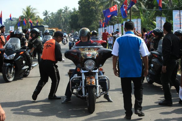 Sultan Ibrahim Iskandar on a motorbike at a show in 2015.