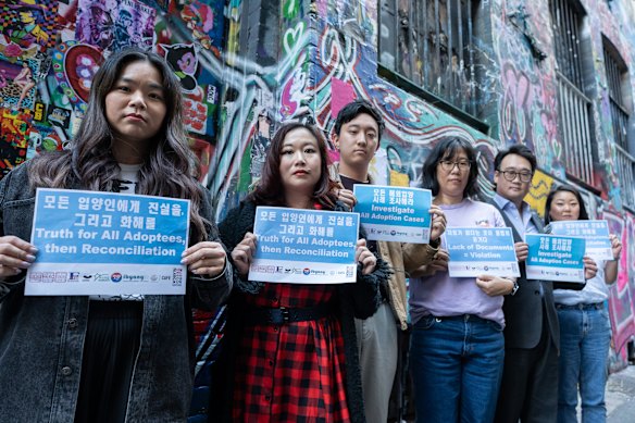 Jessica Walton (fourth from left) at a gathering of the AUSKRG in Melbourne to campaign for the South Korean inquiry to finish its work and for Australia to investigate its own intercountry adoption practices. 