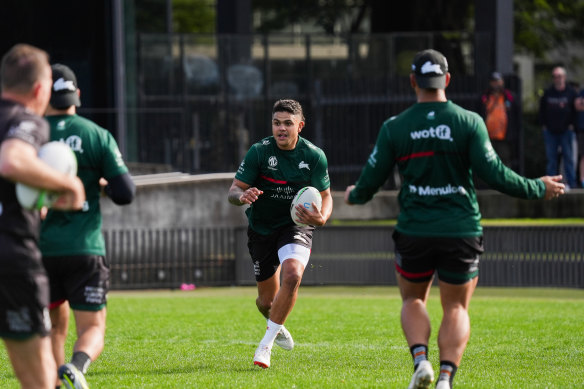 Latrell Mitchell carts the ball up at training on Monday at Redfern Oval.