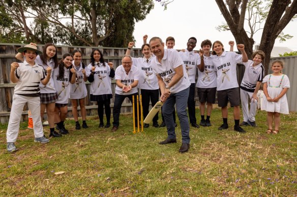 Roger Cook plays cricket in the backyard on Bob Hawke’s old house with students from Perth Modern School and Bob Hawke College.