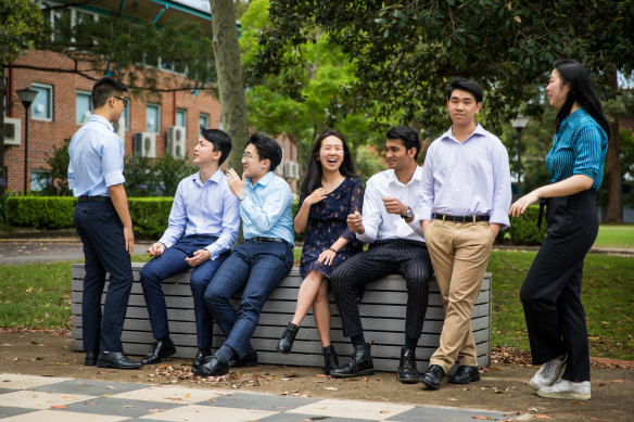 The seven James Ruse students who received an ATAR of 99.95, from left to right: Winston Huang (standing), Eric Huang;  Anthony Hwang; Sariena Ye; Dineth Fernando; Alexander Van Phan; Grace Li.
