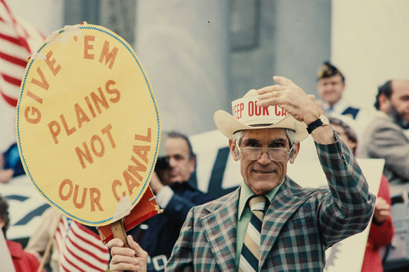 In the 1970s, a protester suggests giving Panama Jimmy Carter’s home town of Plains, Georgia, instead of the Panama Canal. 