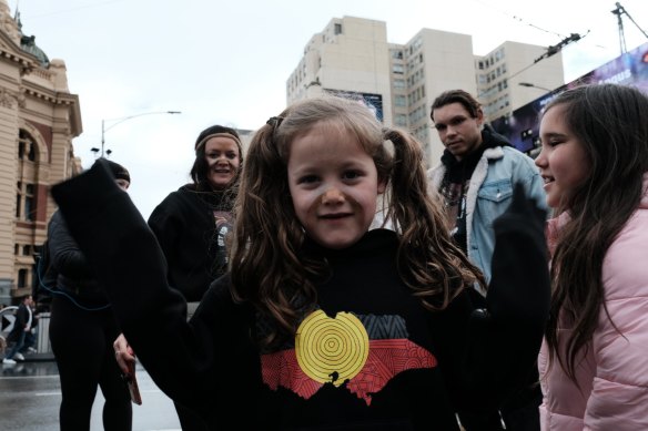 A family attends the NAIDOC Week march in Melbourne in 2022.
