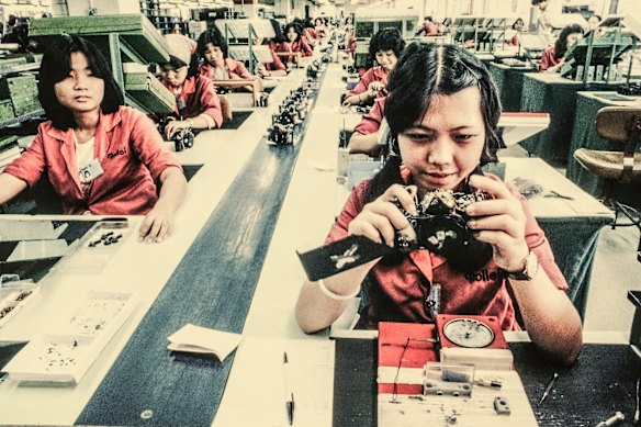 Women assemble cameras in a factory in Singapore in the 1980s.  