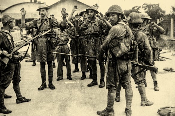 British soldiers surrender to a patrol of Japanese troops in Singapore in February 1942.