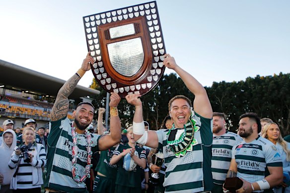 Wes Thomas (left) raising the Shute Shield for Warringah last year after defeating Eastern Suburbs.