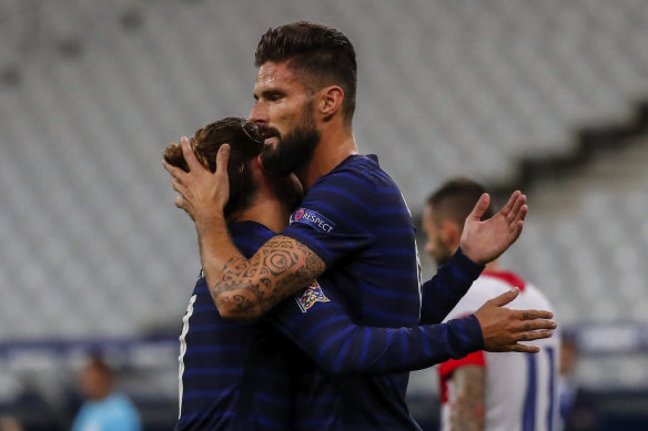 Olivier Giroud celebrates with Antoine Griezmann after scoring in France's win over Croatia, the 4-2 scoreline a repeat of the 2018 World Cup final.