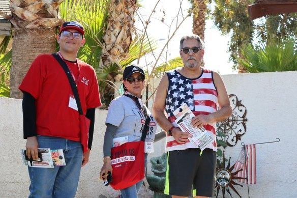 Brian Torres Suazo and Maria Polanco with a resident who didn’t wish to give his name.