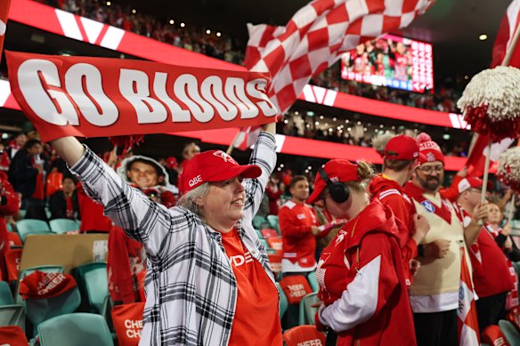Sydney Swans fans celebrate after their team beat North Melbourne.