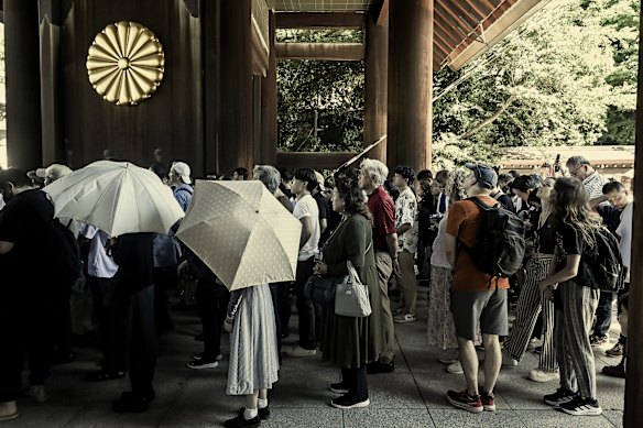 People pay respects to Japan’s war dead at Yasukuni Shrine in Tokyo in August as the nation marked the 80th anniversary of the end of World War II.