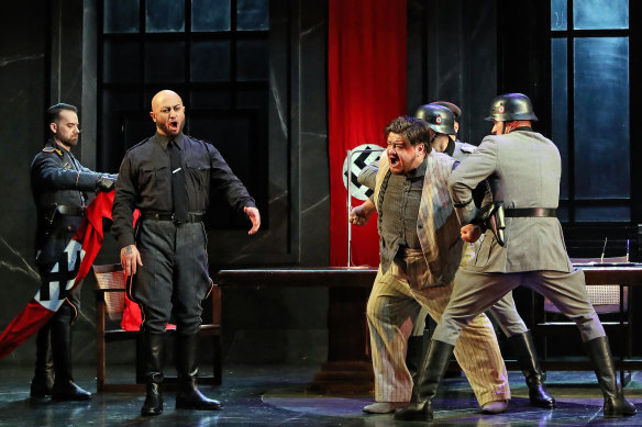 Marco Vratogna as Scarpia and Diego Torre as Tosca’s lover, Cavaradossi in a  torture scene in Opera Australia’s ‘Tosca’.