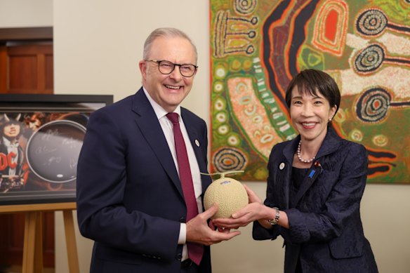 Australian Prime Minister Anthony Albanese accepts a Shizuoka crown melon from Japanese Prime Minister Sanae Takaichi in Canberra in May. 
