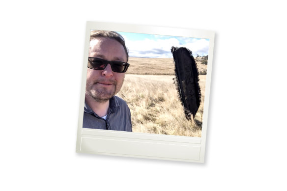 Scientist Brad Tucker with a piece of space junk that fell on a farm in NSW in 2022.