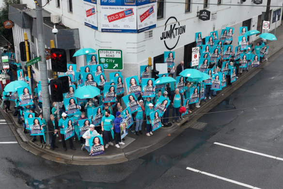 A flash protest at Kew Junction during the election campaign - along with a sole Frydenberg supporter.