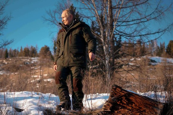 Russian President Vladimir Putin poses for photos on a Siberian holiday, March 2021