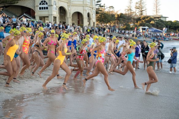 Swimmers headed off in different groups from Cottesloe.