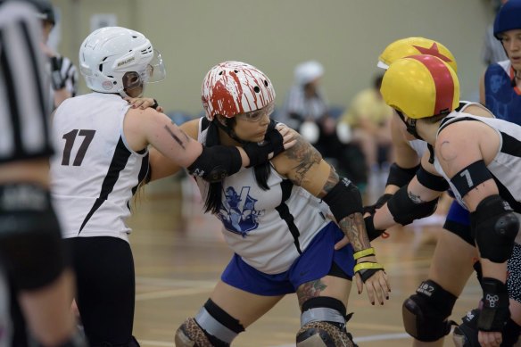 Mel Buttigieg competing in roller derby in her 30s.