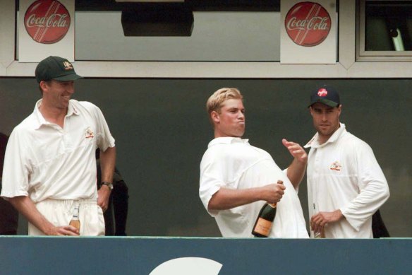 Bravado: Shane Warne, centre, pictured celebrating victory over England at Old Trafford in 1997.