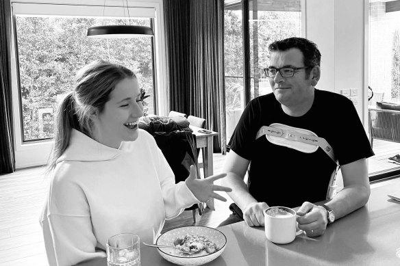 Andrews pictured wearing a spinal brace at home with his daughter after his accident.