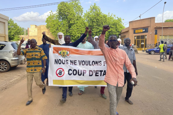 Supporters of Nigerien President Mohamed Bazoum demonstrate in his support in Niamey, Niger.