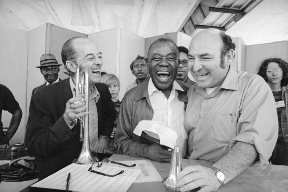 George Wein, right, with the trumpeter Bobby Hackett and Louis Armstrong at the Newport Jazz Festival in 1970.