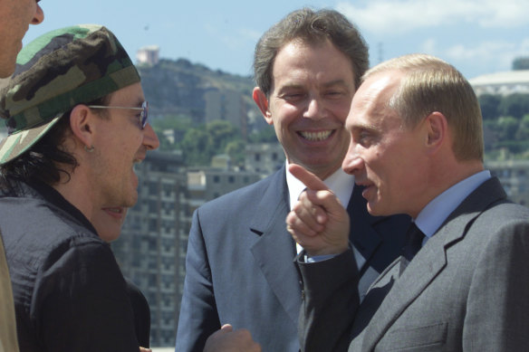 Bono with Tony Blair and Vladimir Putin in Genoa at the G8 in 2001.