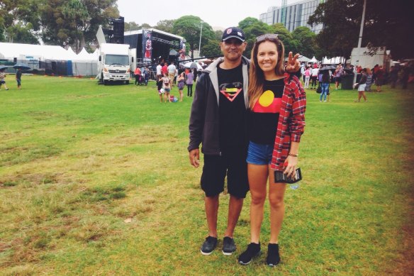 Marlee, proudly flying 
the Aboriginal flag, with 
her father, Rod.