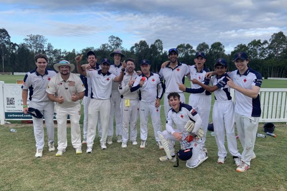 The Mudgeeraba team celebrate Gareth Morgan’s (with ball) remarkable feat.
