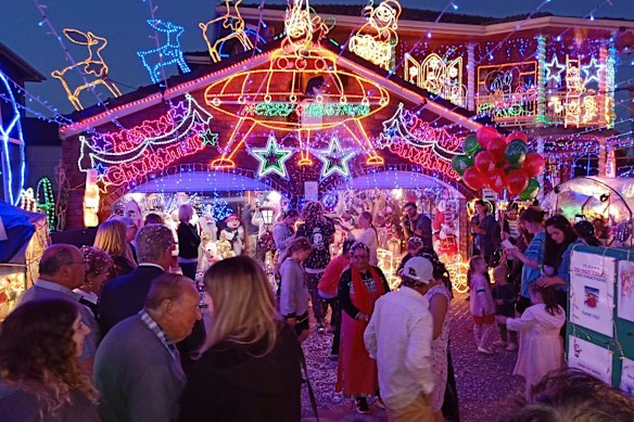 People enjoying the Christmas lights at the Filippini home in 2019.