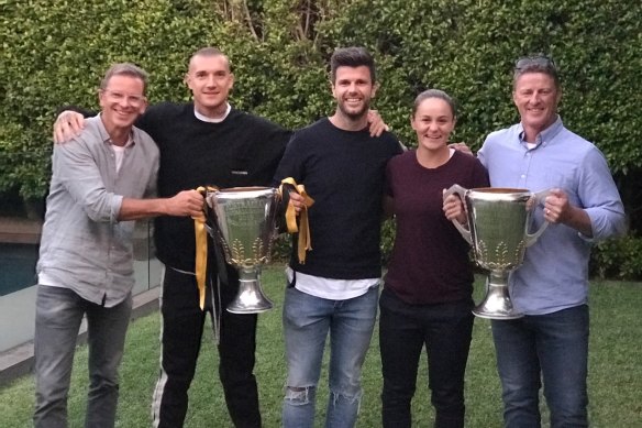 From left, Crowe with some of those he has mentored: Richmond players Dustin Martin and Trent Cotchin, Ash Barty, and Richmond coach Damien Hardwick.