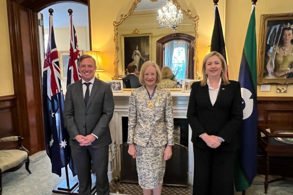 Premier Annastacia Palaszczuk, right, and Deputy Premier Steven Miles, left, at a ceremony with Governor Jeannette Young, centre, who bestowed on them new Paralympic titles.